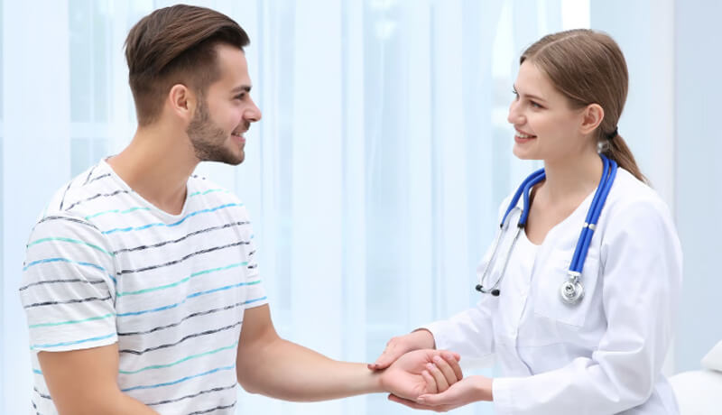 Doctor assisting patient during hotel visit in Thessaloniki