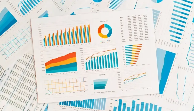 Charts and graphs displaying data analysis, representing the role of bioinformatics in precision oncology.