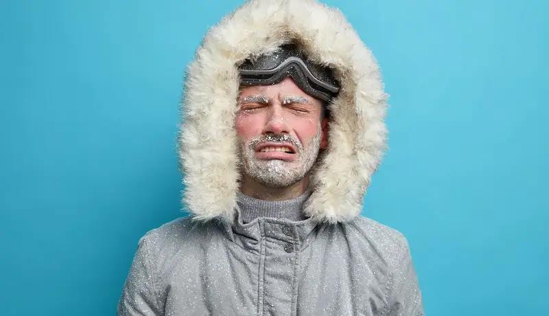 A man being upset because of the cold
